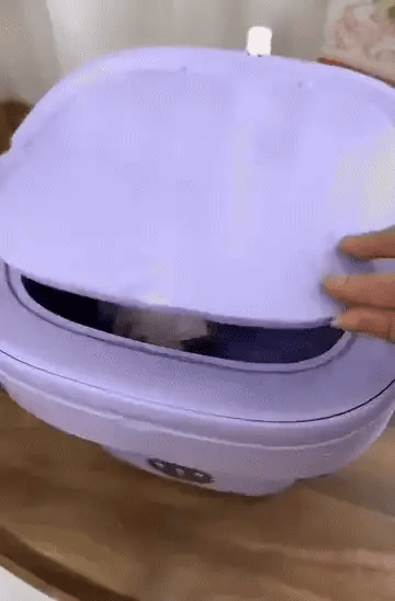 Foldable mini laundry machine by Bloom Mart, compact and portable, shown in a folded and unfolded state for easy storage and use.